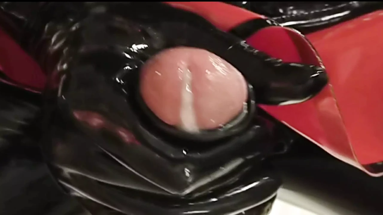 Black and red latex wank