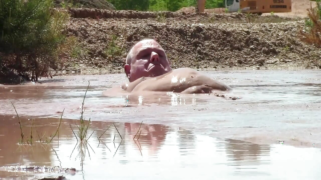 Deep, Creamy Brown Mud Bath in a Sand Pit