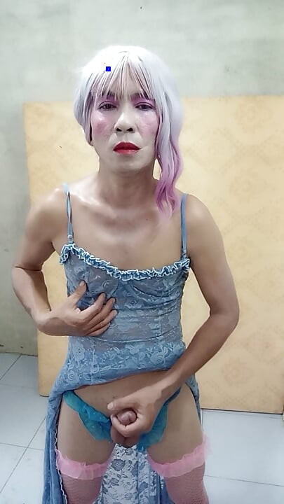 Oanh Le shemale eyes sexy dress porn standing with a happy cock leaning on her back