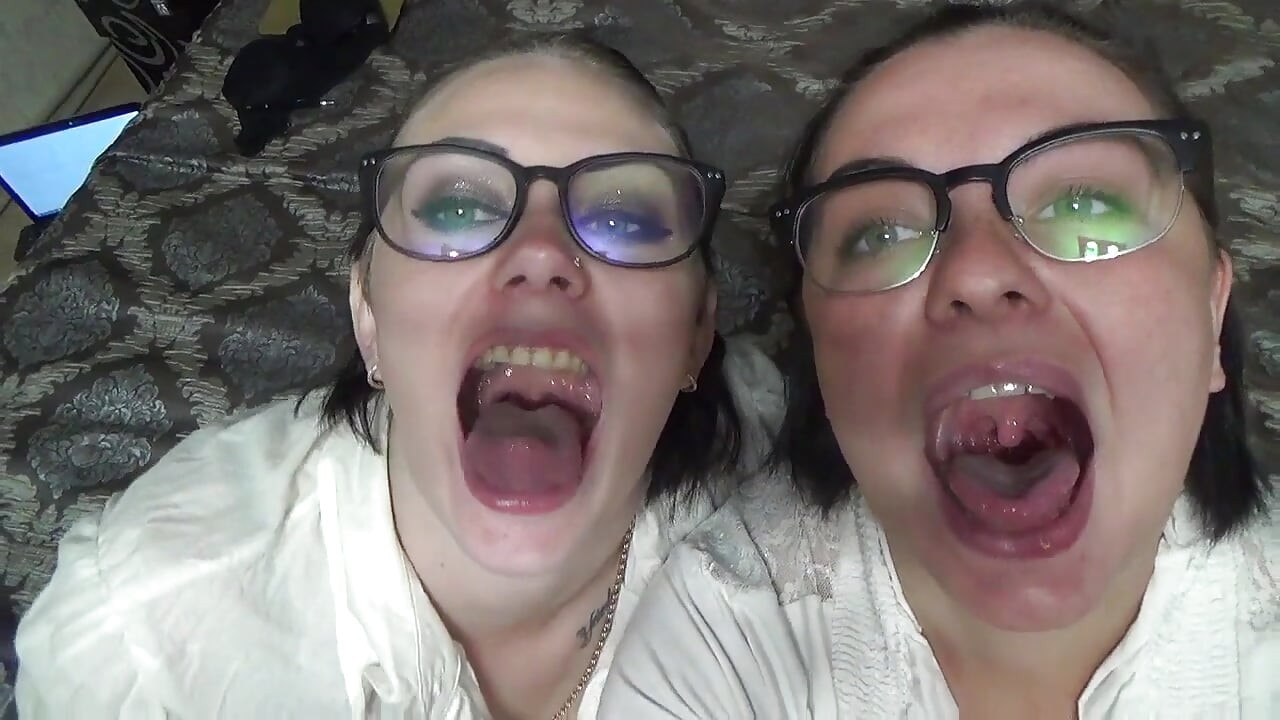 Two business women taunt you with their mouths & tongues before eating you whole!