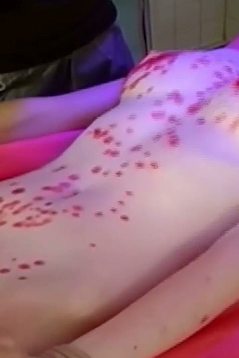 Mature Nurse Joins Doctor for Intense Patient Examination