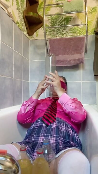In a schoolgirl outfit to take a piss shower with bottles