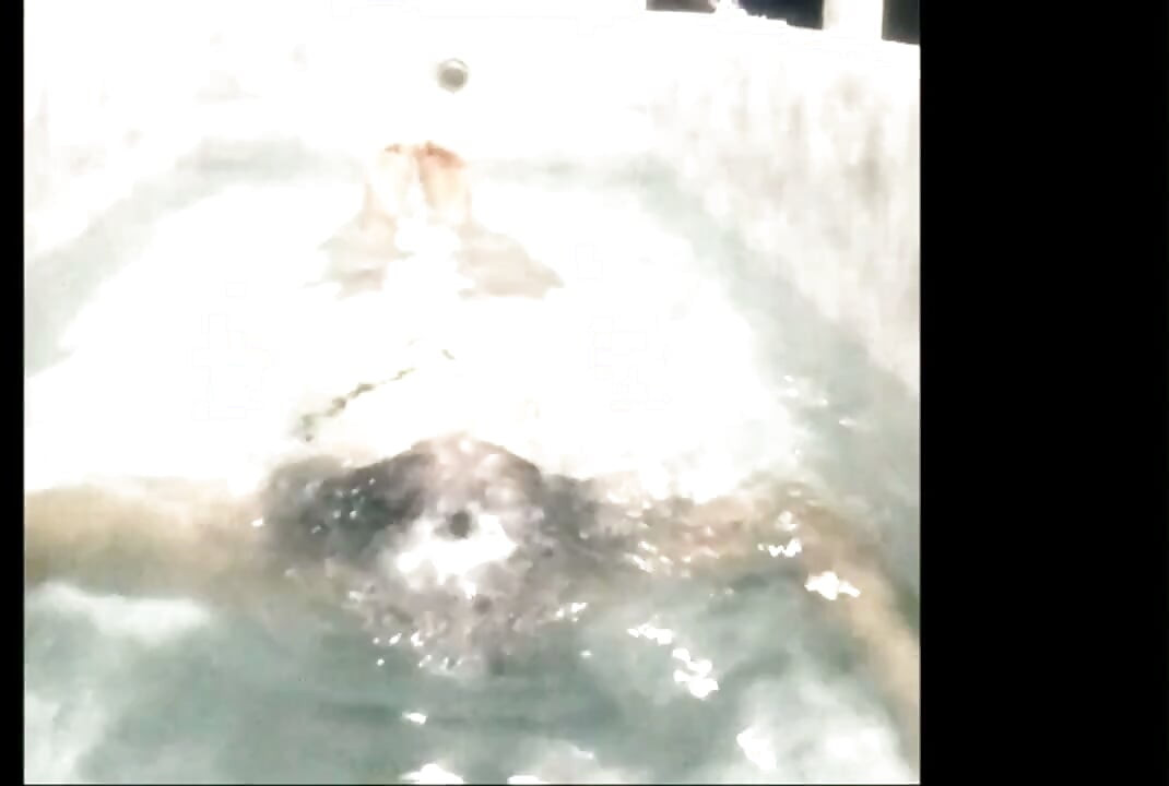 Bandar sissy dunking in bathtub blowing bubbles
