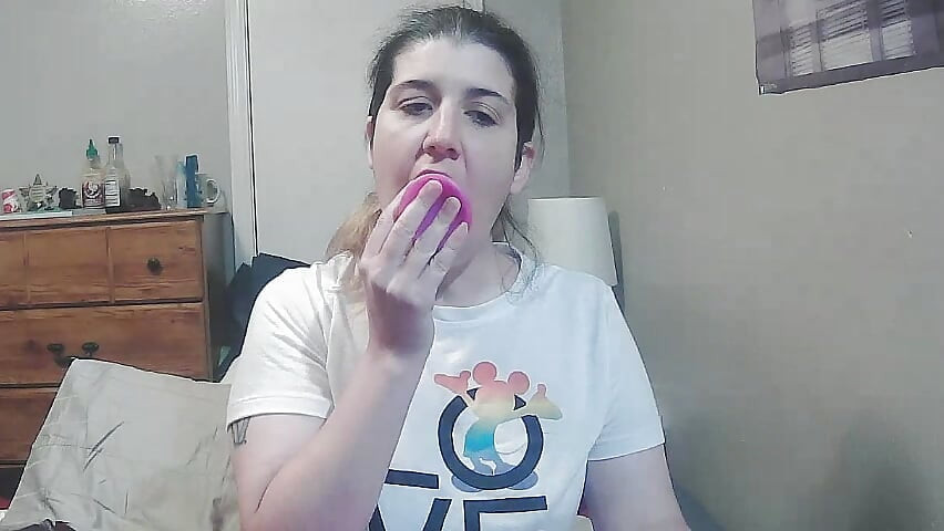 Blowing a dildo
