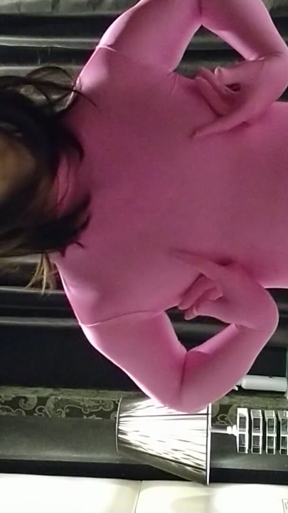 Cross-dressing boy masturbates in pink full-body tights | Clip 1