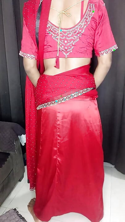 Indian sissy wearing hot red saree and red peticot