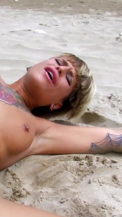 Jaw-dropping moment from "Horny tattoed blond teen with pierced nipples takes deepthroat on beach"