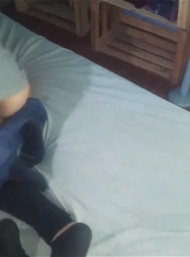 I Took From the Side a in a White Shirt and Black Shoes at Dusk