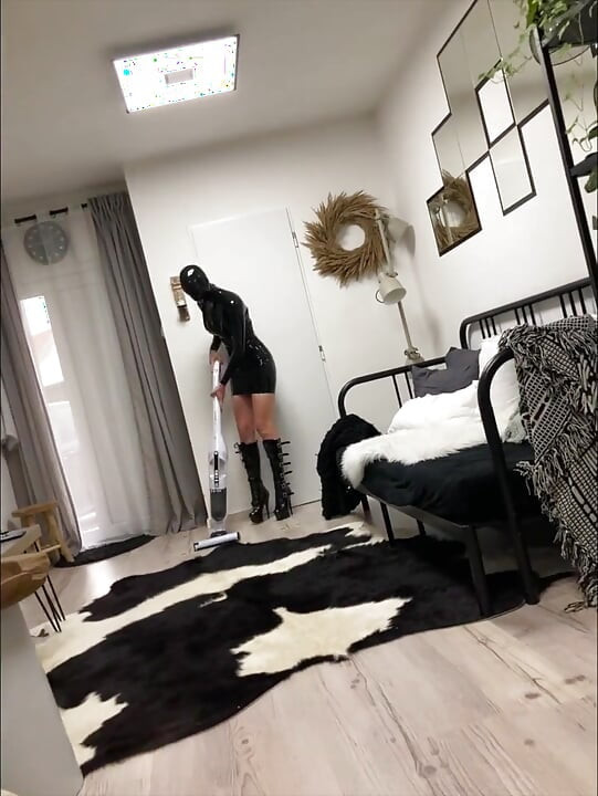 Latex maid service in high heels and chains