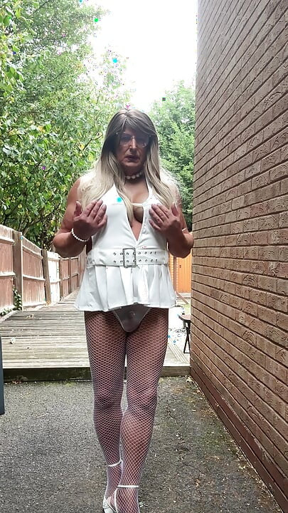 Sexy Crossdresser kellycd2022 in sexy white mini dress and fishnet pantyhose and heels