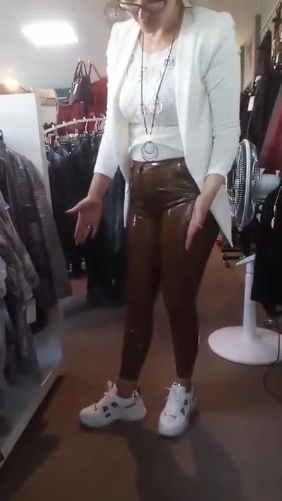 Wife in brown Latex Pants in her boutique
