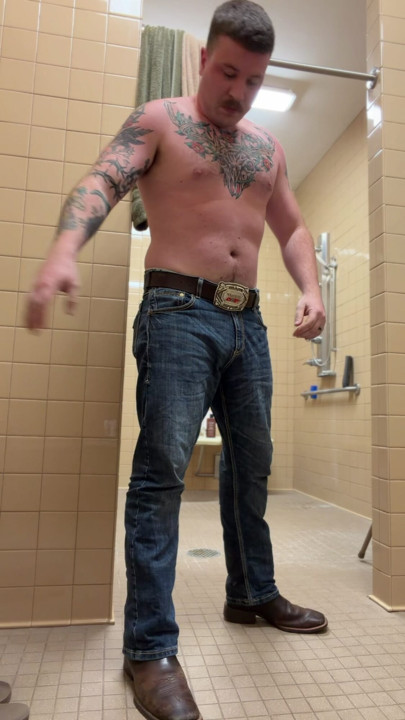 Uncut tattoo jock showering after gym