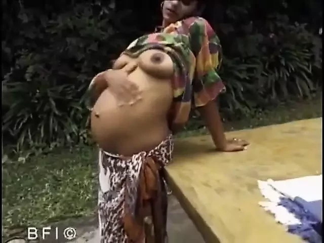 Darkhaired pregnant chick is sucking and fucking hot cock in the garden