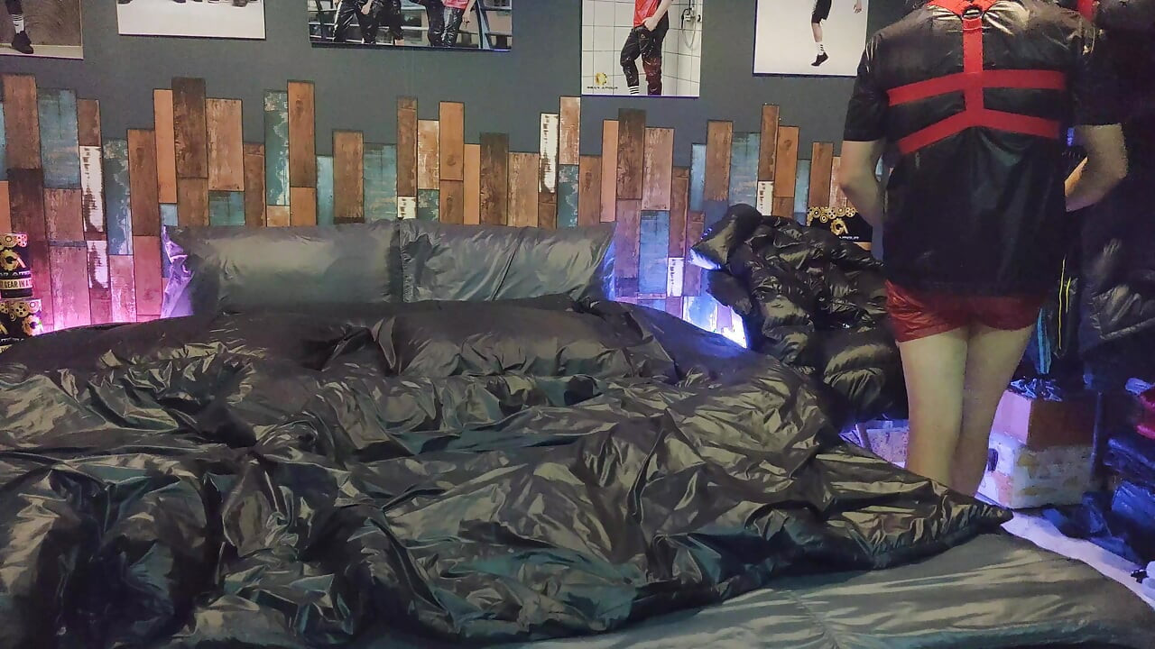 Cock Rubbing Down Jacket on Shiny Nylon Bed