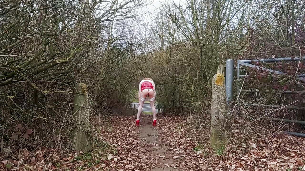 Crossdresser Roadside Wanking in Red PVC