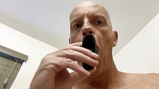 Mature bald guy has fun with butt plug