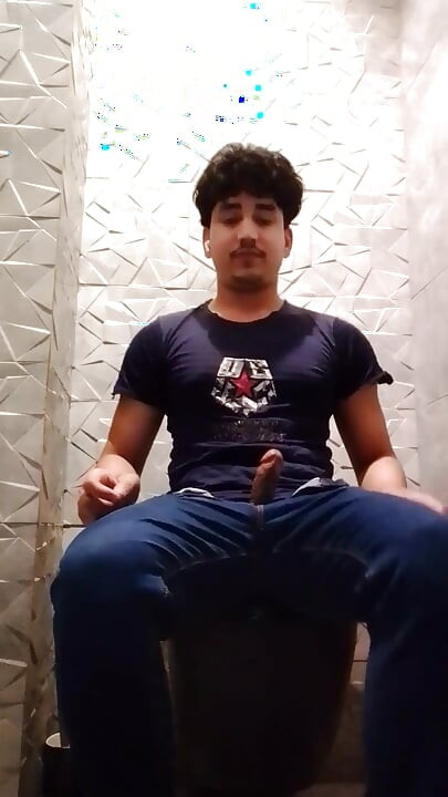 Indian Handsome Boy While His Hard Penis Is Erect and He Strokes His Hand Again in the Toilet Video