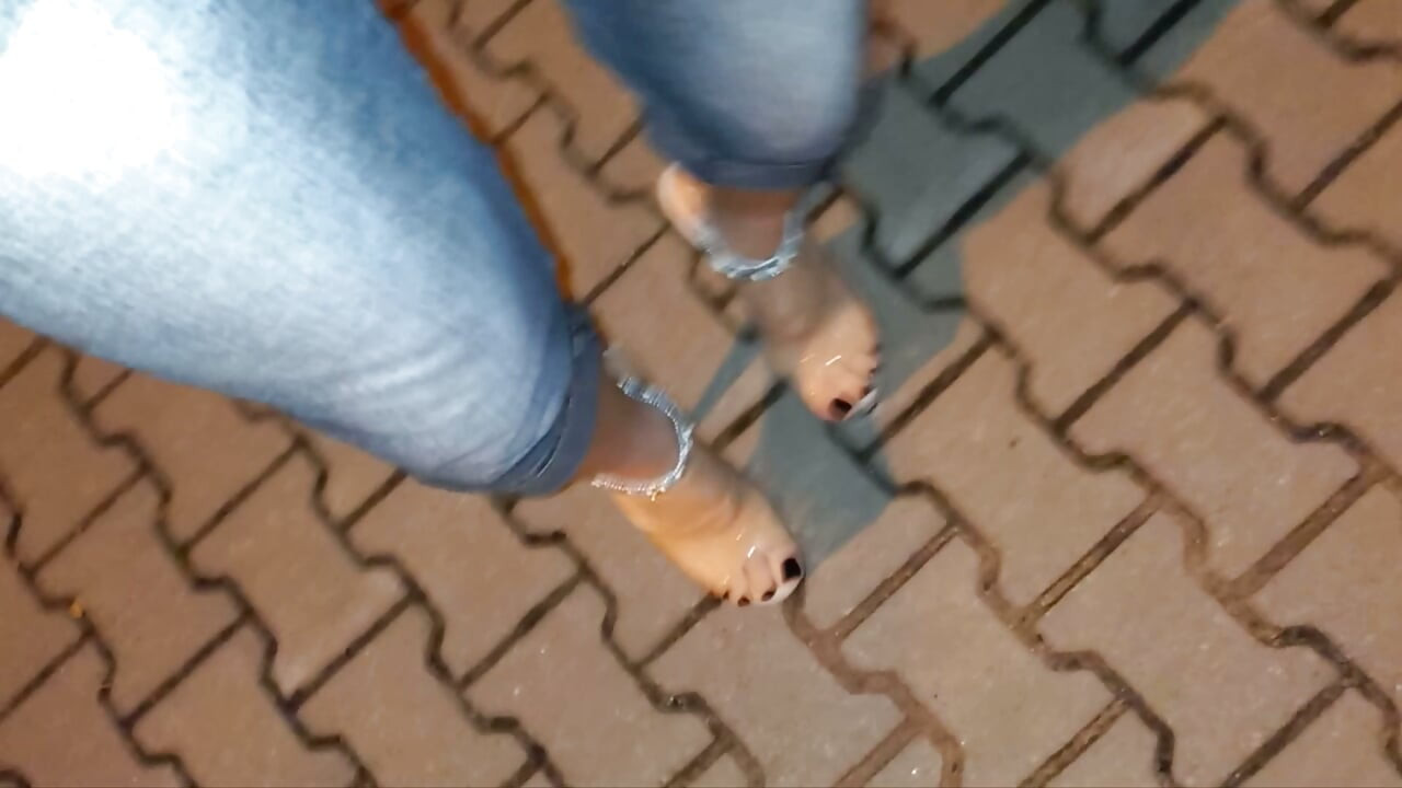 nighttime crossdressing on a public street in 20cm stripper heels, black toes, and black claws