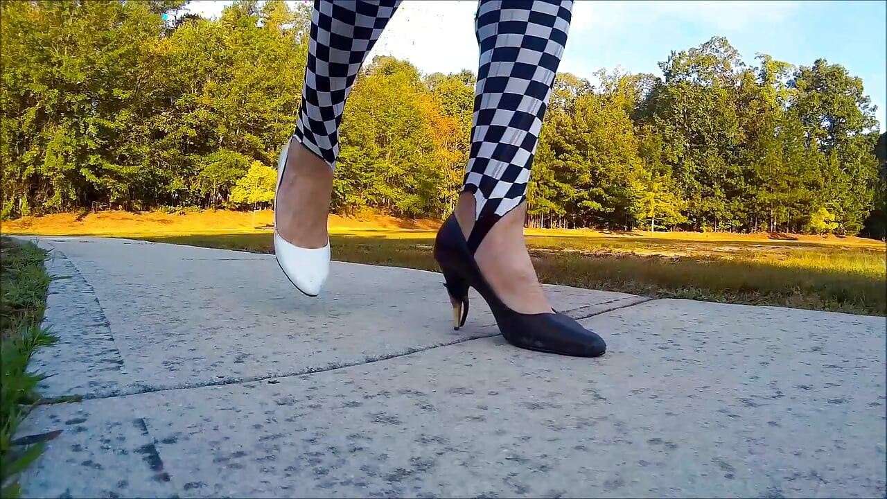 Crossdresser Walking in a public park in high heels