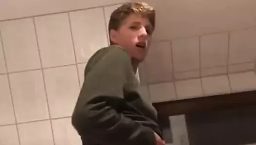 A gay man from Germany jerks off his big dick in the bathroo