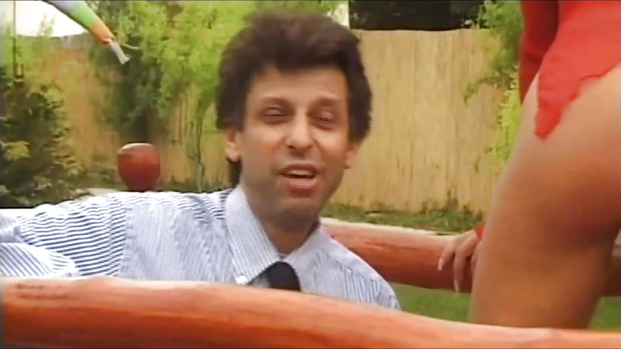 Fucked on the Garden Table by Two Hard Cocks While the Director Watches