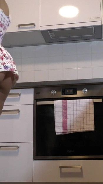 Epic moment from "Hot Brunette Bored Wife in a Mini Modified Sun Dress to Flash her Tight Shaved Pussy in the Kitchen"