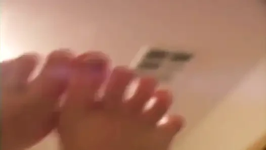 Black haired slut sucking and licking her toes