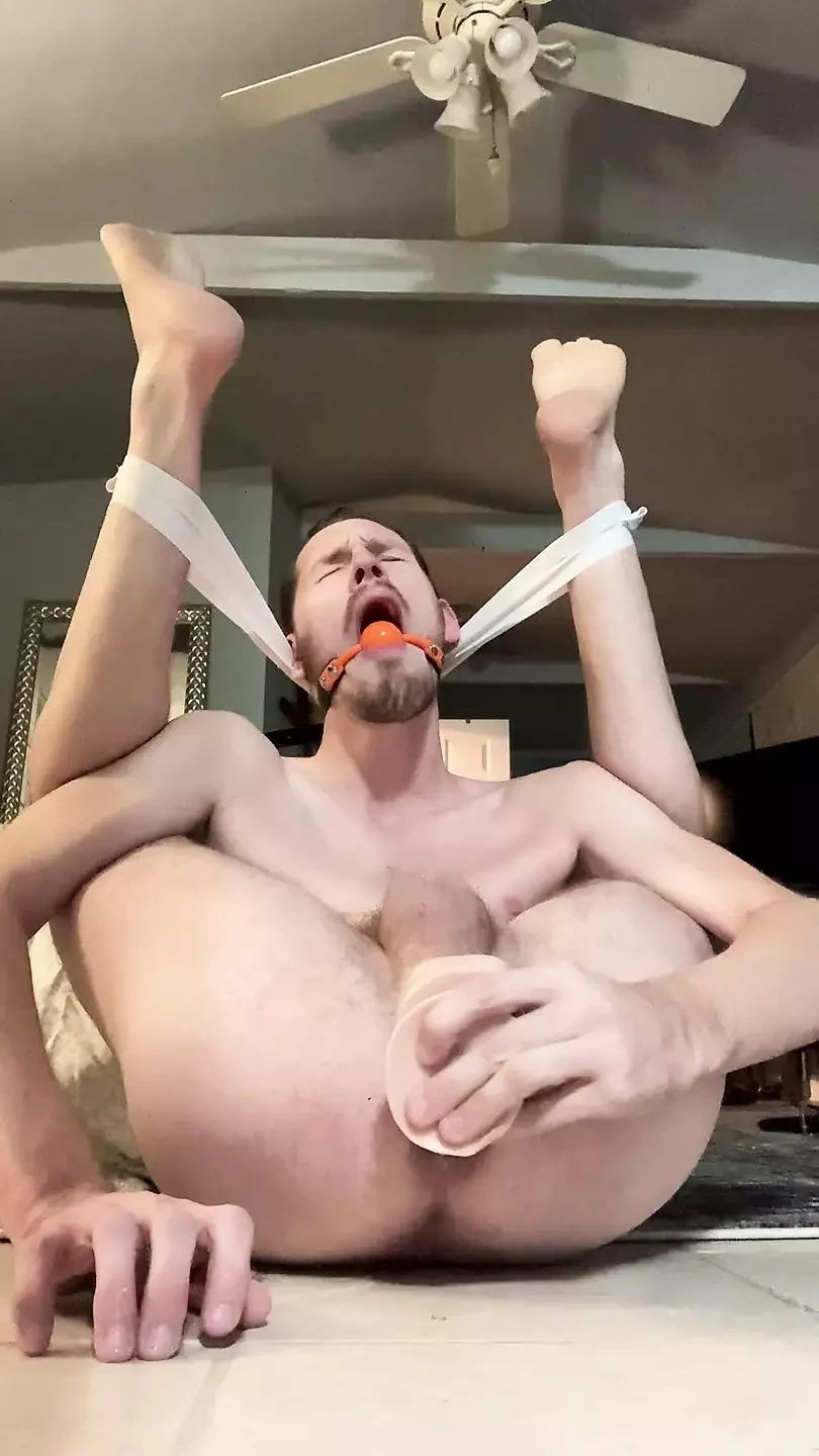 Pretzel faggot bounces on dildo and gapes hole