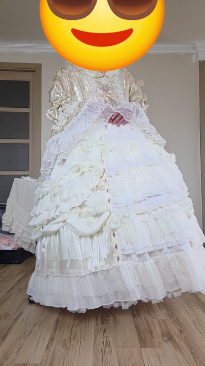 A crossdresser dancing in a dress.