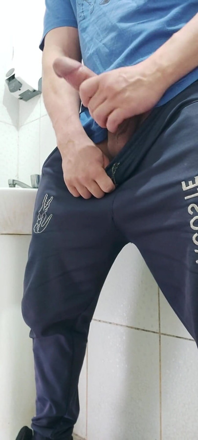 A Well-endowed Brazilian Man Urinating and Showing His Thick Penis to His Female Friends.
