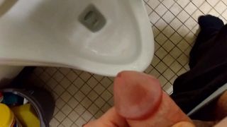 Blasting a huge load over a urinal