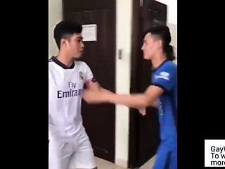 Two Asians wearing soccer uniform have sex