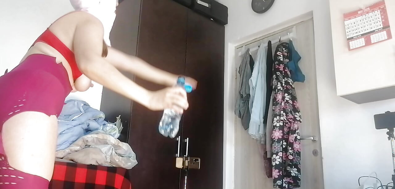 Amateur wife has fun trying on clothes and cutting them. Amateur wife vacuuming naked in the house.
