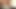 Redhead ladyboy in fishnet bodystocking is masturbating solo