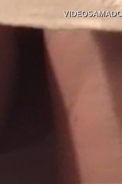 Naughty brunette pretends she doesn't want to, but lets amateur cameraman film her naked