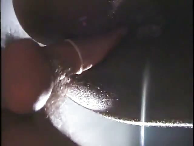 Manly stud sits back on a chair and lets his black lover blow his dick
