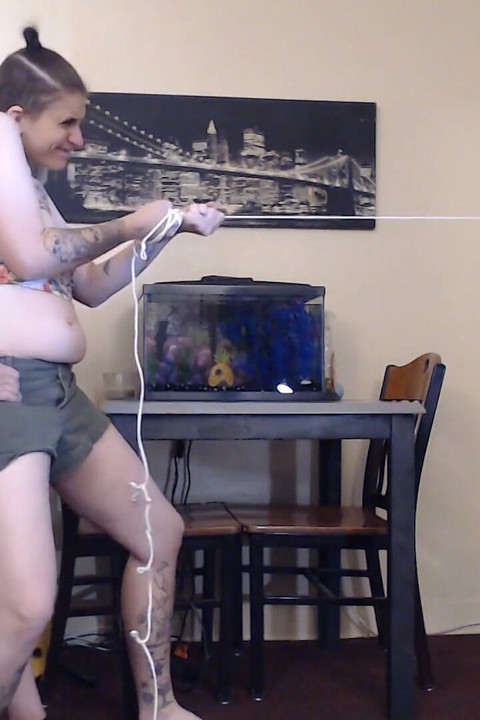Two girls pulling rope