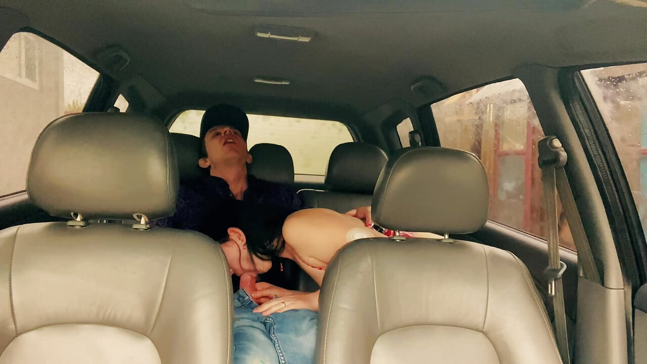 Wife cheating with a taxi driver in the car outside the house