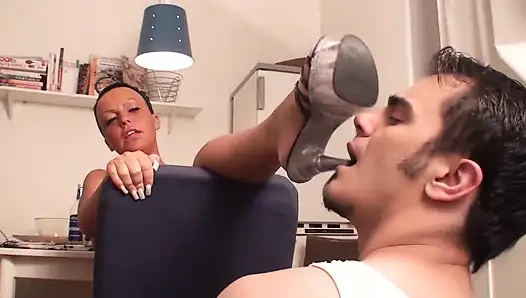 Richie kneels in the kitchen