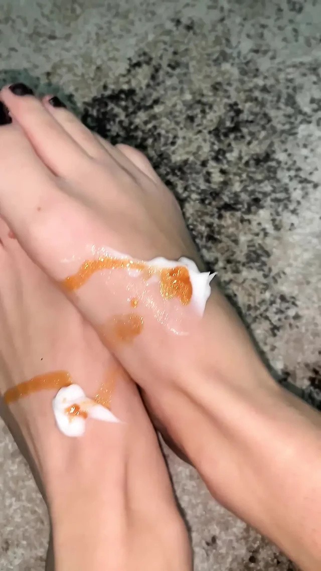 Playing with my feet with a body oil and cream