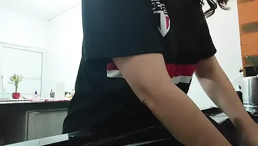 Woman teasing while washing dishes. She loves to transmit to the voyeurs on duty