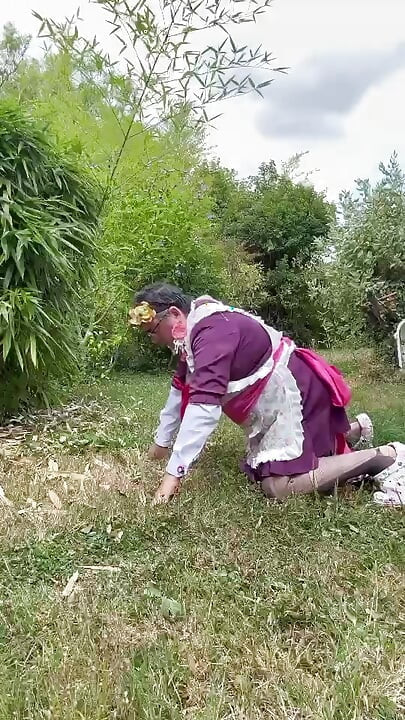 In gardener's outfit, peeing on all fours like a dog