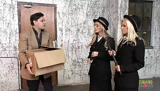 Two blonde milf police officers arrest a guy and take him to the back alley for a threesome