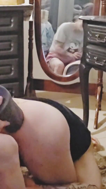 Captivating moment from "Femdom anal fisting with a big dildo in her ass"