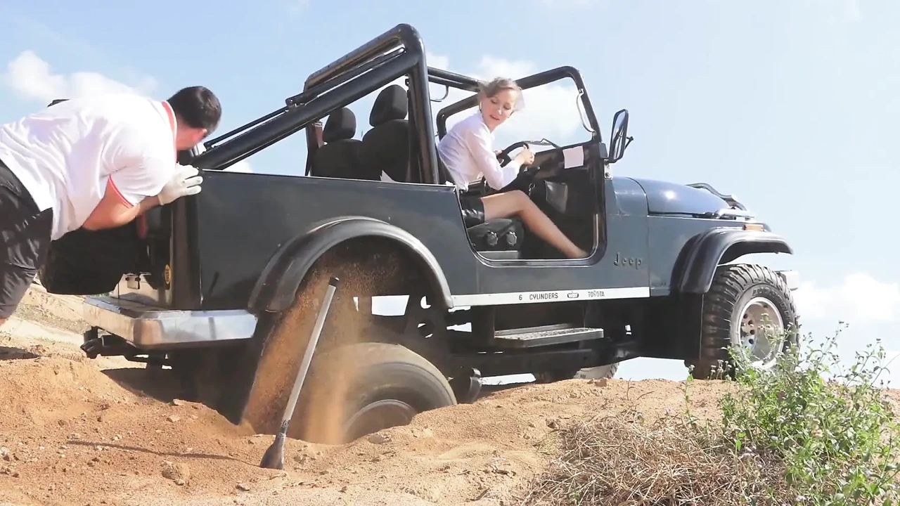 Get out of the car and push the car harder...