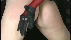 Young pain-loving brunette is bound and whipped by older mistress in dungeon