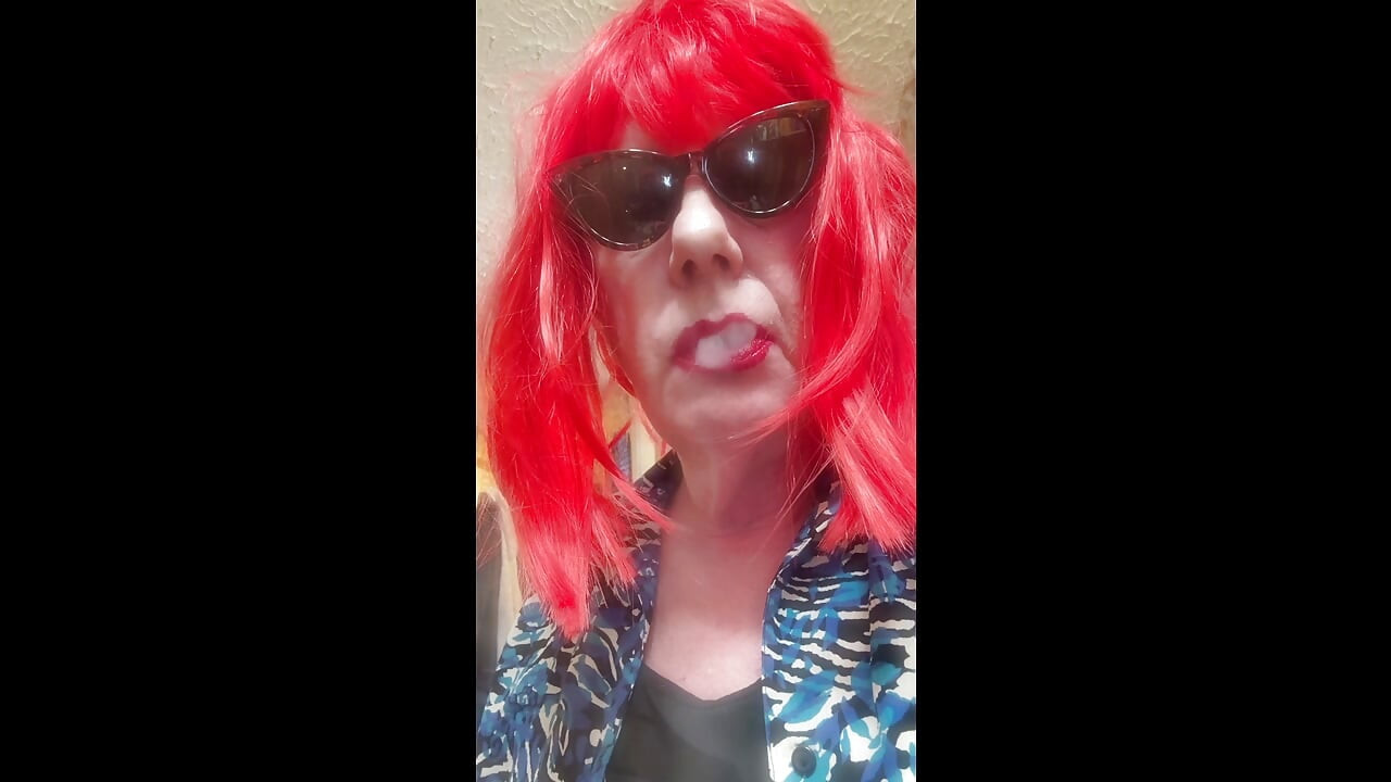 MRS. ROMAN DESTROYING A MARLBORO 100 MENTHOL CLOSE UP - WITH DANGLING AND NOSTRIL EXHALES