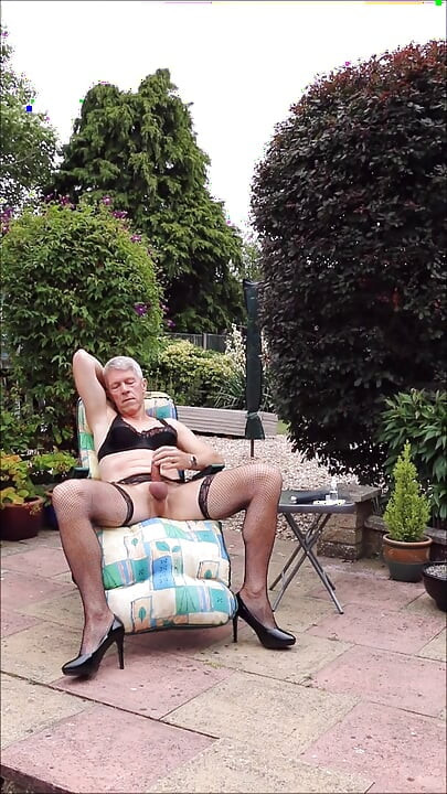 Wank and cum outdoors in black fishnets and heels