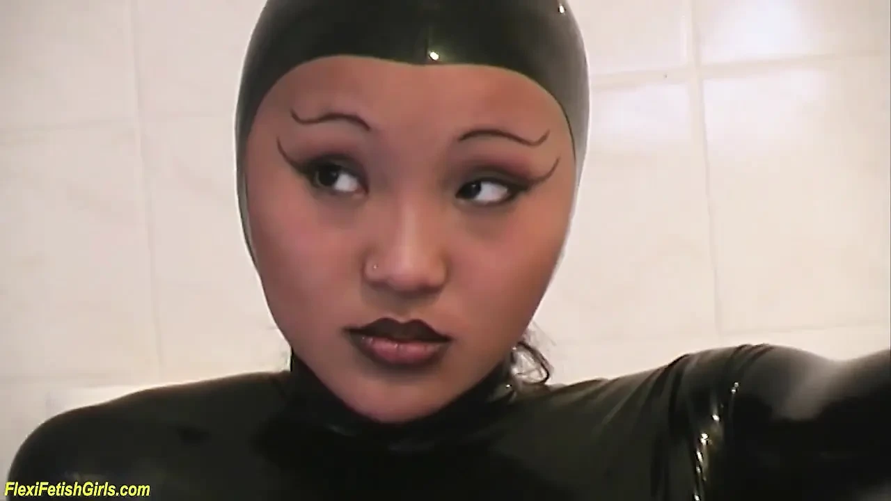 Cute young asian latex teen stretching her flexi body