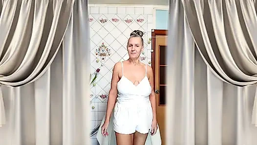 Hot housewife Lukerya. A mature Ukrainian woman shows off her figure and poses for the camera at home.